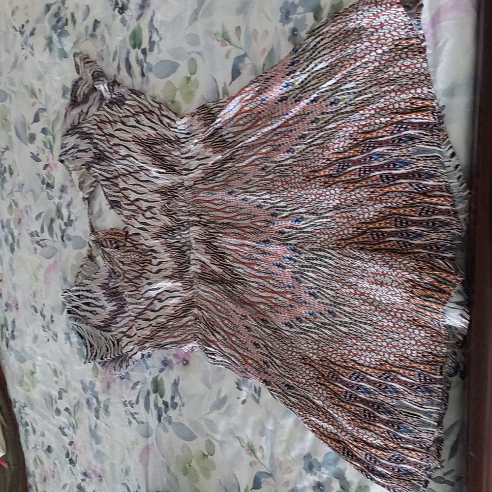 Multi colored romper with back opening and tie up